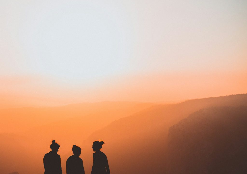 Three girls watching the sunset